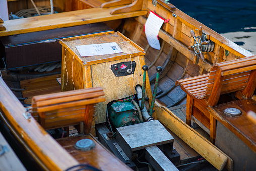 Oslo, Norway - July 19 2014: Vintage Marna engine in a small wooden boat.