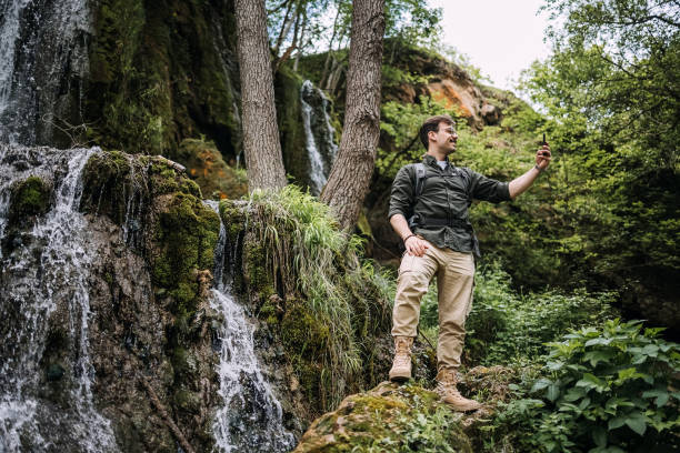 istock Man photographs nature 1495894885
