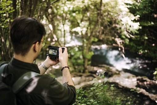 Man photographs nature with his camera