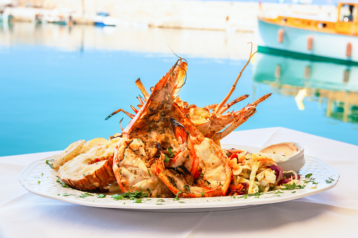 Traditional lobster dish served at seaside taverna in Rethymno. Crete, Greece