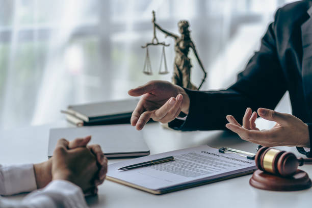 istock Brass scale on wooden table in office Advice law, justice concept, good service cooperation, businessman consulting and male lawyer or judge consultant having a team meeting with clients, 1495897172