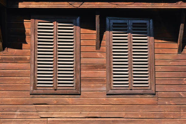 windows on the vintage wooden wall stock photo