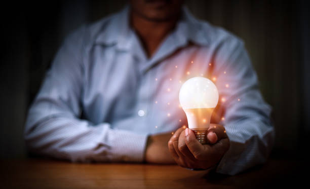 istock Man hands holding light bulb for Concept new idea concept with innovation and inspiration, innovative technology in science and communication concept 1495904650
