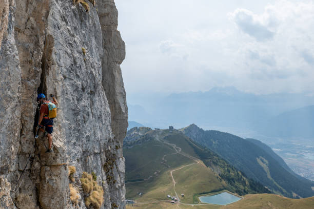 istock Man on Via Ferrata climbing up, summer activities concept 1495905041