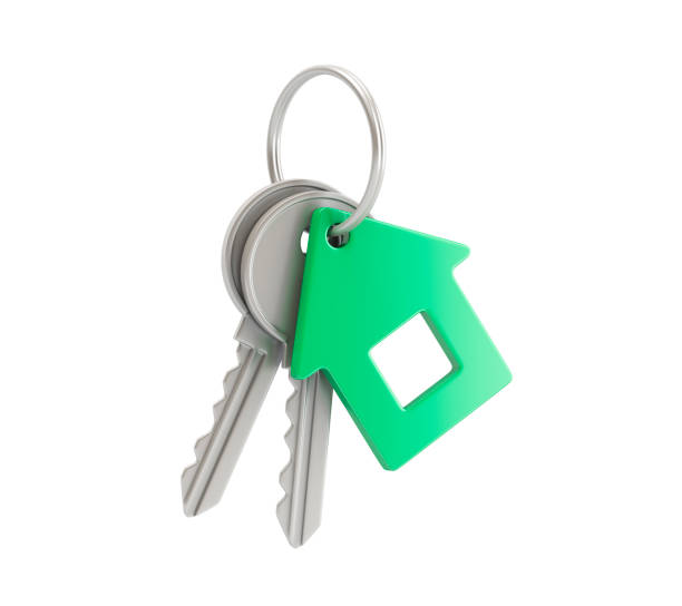 clés sur un anneau avec porte-clés de maison verte - key house house key green photos et images de collection