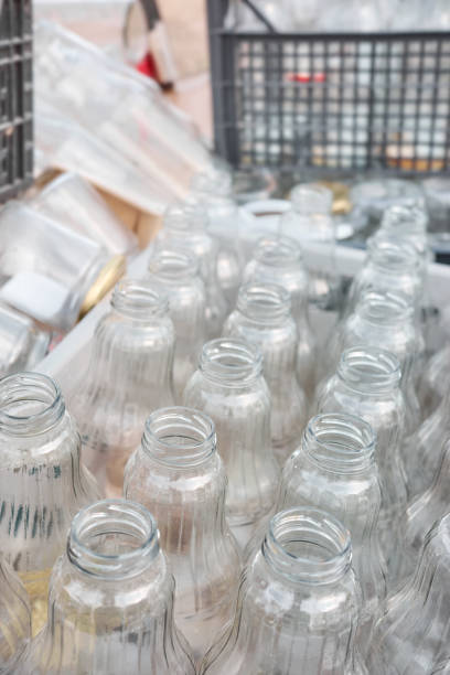 istock Used empty glass bottles stored for recycling, selective focus 1495906849