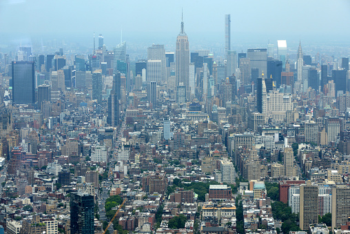 aerial view over Lower and Midtown Manhattan with East River