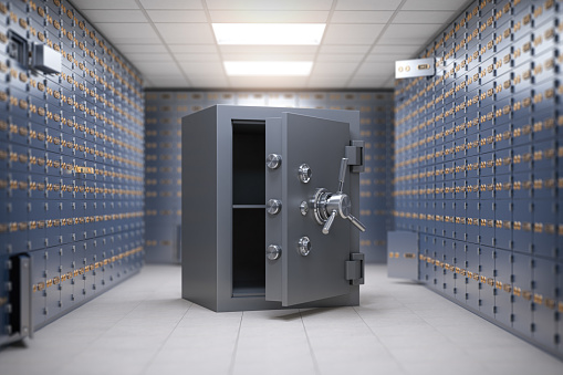 Safe vault in a safe deposit box room of a bank. Safety and security of savings concept. 3d illustration