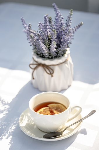 Cup of tea on the table and lavender