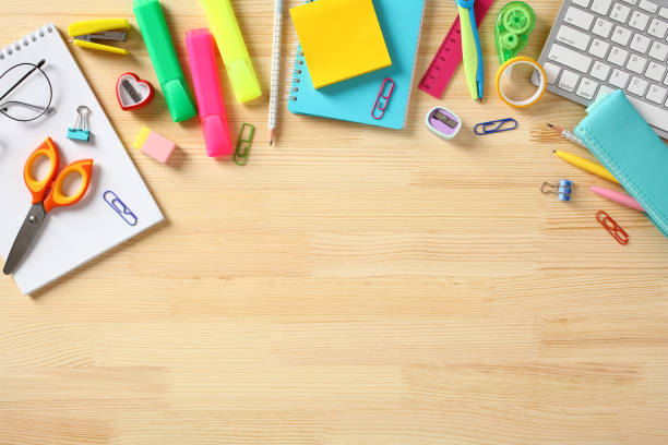 istock Back to school concept. Colorful school items on wooden desk table. Flat lay, top view, overhead. 1495913721
