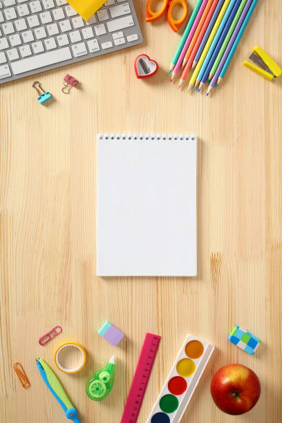 istock Empty notepad with school accessories on wooden table. Back to school concept 1495914034
