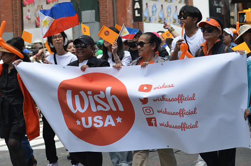 The Wish USA marches way up Madison Avenue, Manhattan  in New York City during the annual Philippine Day Parade.