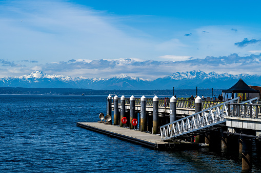 Seattle WA, USA - April 26, 2023:  People enjoy a beautiful Spring afternoon one Pier 62.