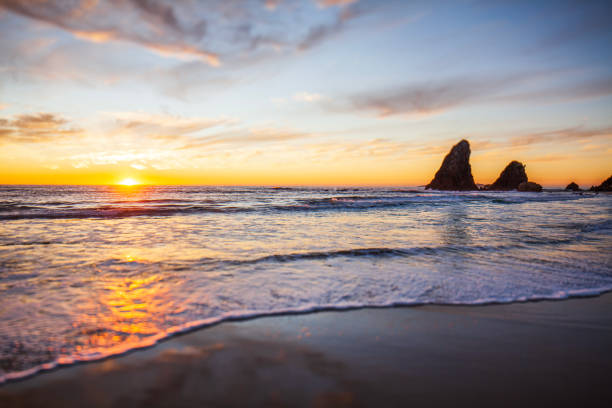 istock Golden sunrise with dramatic sky over a smooth morning ocean 1495923077