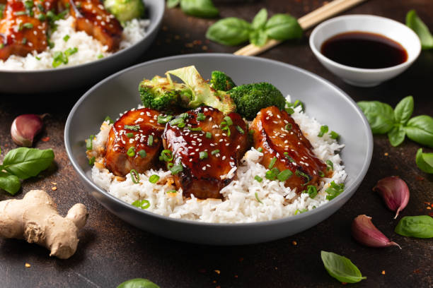 Teriyaki Pork Belly with broccoli, spring onion and rice Teriyaki Pork Belly with broccoli, spring onion and rice. sticky sesame chicken sauces stock pictures, royalty-free photos & images