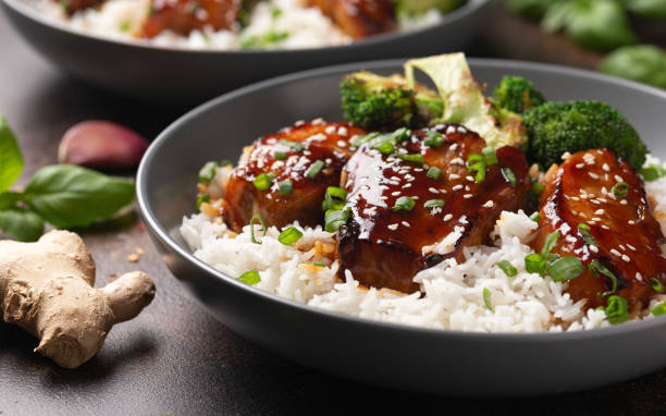 istock Teriyaki Pork Belly with broccoli, spring onion and rice 1495923141