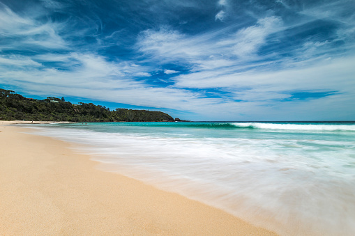 Perfect sunny day at the beach with clear blue sky and white sand, photographed on the coast of South Eastern Australia.