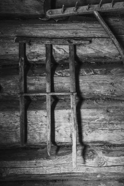 Authentic old wooden pitchfork for collecting leftover hay in the village.
