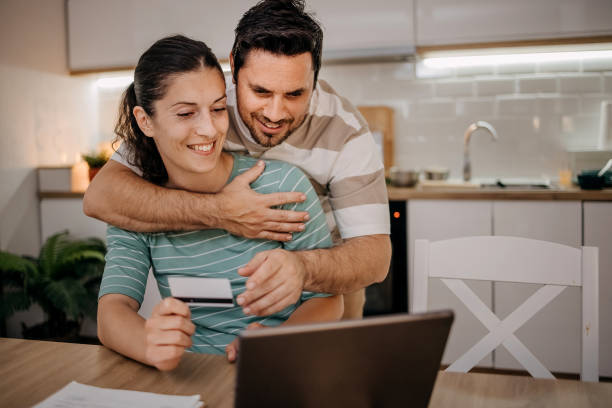 istock Couple pays bills online 1495926495