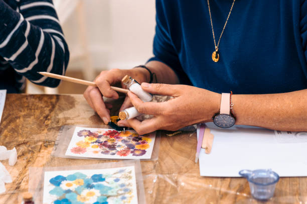istock Epoxy jewelry workshop. Resin Magic: Women Create Unique Epoxy Earrings in Jewelry Class 1495928148