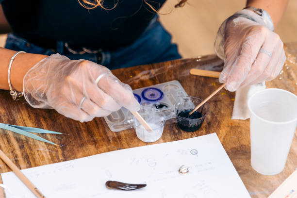 istock Epoxy jewelry workshop. Resin Delights: Women Express Creativity Making Unique Epoxy Earrings 1495928196