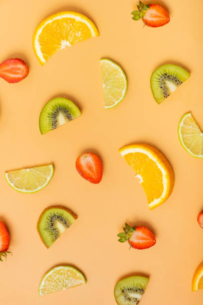 istock Citrus fruits and strawberries, pattern flat lay, top view.  Summer layout on colored background 1495930273