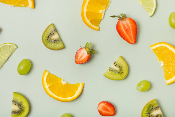 istock Citrus fruits and strawberries, pattern flat lay, top view.  Summer layout on colored background 1495930274