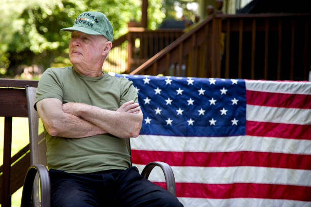 istock Vietnam Veteran sitting arms folded looking away 1495932735