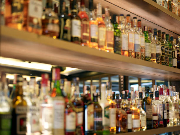 istock View to a lot of different alcohol bottles at a bar 1495947368