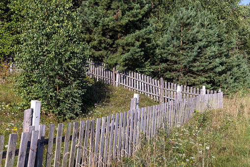 Wooden fence for security, delineation of the territory of different sites using wooden fencing