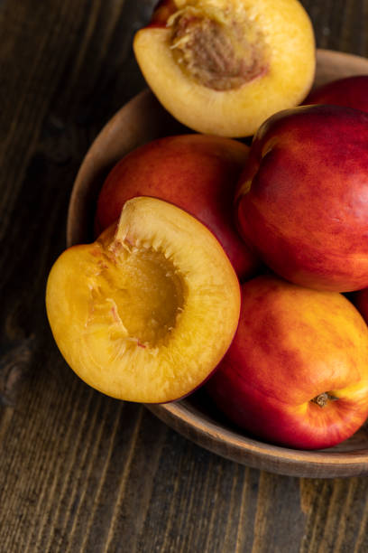 istock Nectarines folded in a wooden bowl 1495951119