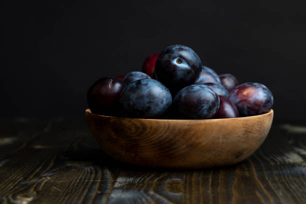 istock Ripe plums on the table in the kitchen 1495953011