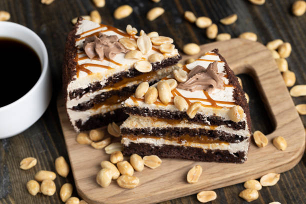istock a piece of chocolate cake with caramel and peanuts 1495953067