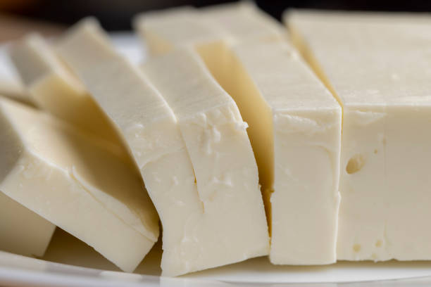 istock Sliced cream cheese for salads 1495953188