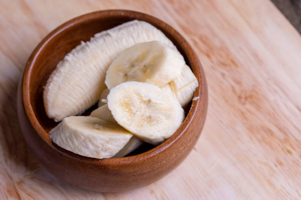 istock Sliced ripe banana on a cutting board 1495953287