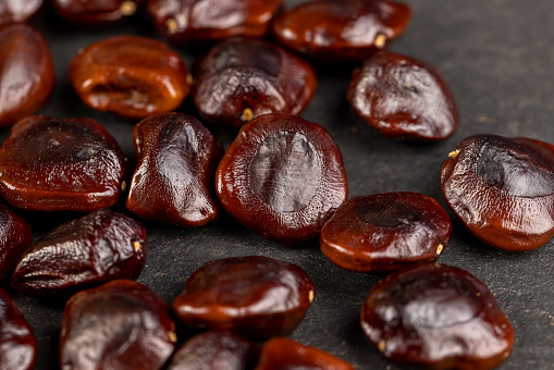 The surface texture of selected dried dates. Natural oriental sweets. Selective focus.