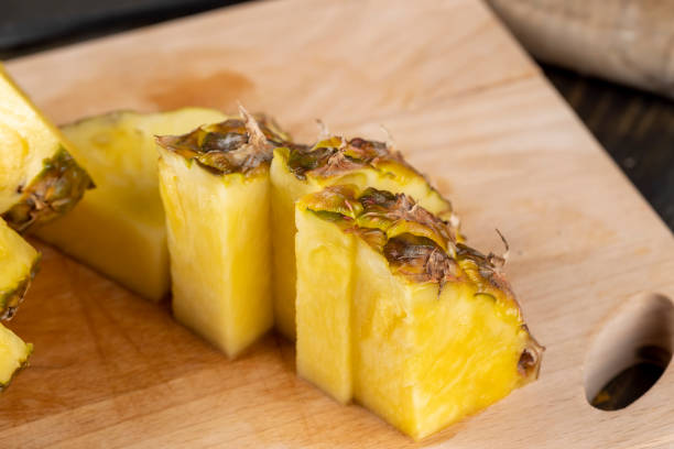 istock Sliced delicious ripe pineapple yellow, close up 1495954255