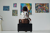 Woman enjoying art in gallery