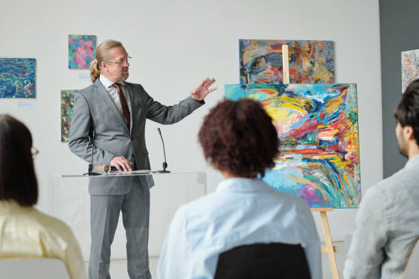 istock Gallery owner presenting the modern art 1495955093