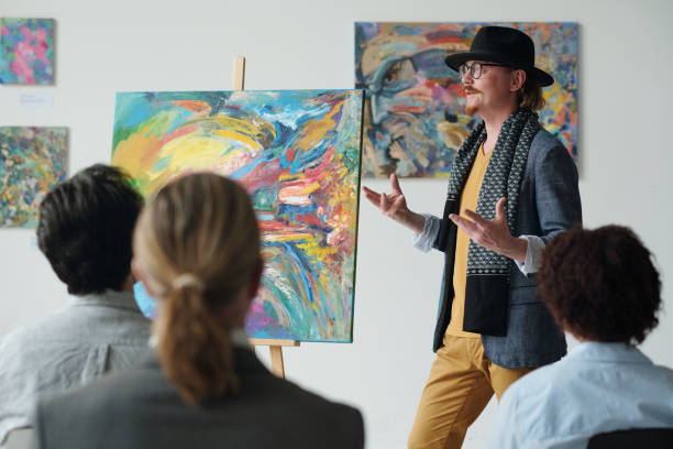 istock Artist presenting his art at art exhibition 1495955713