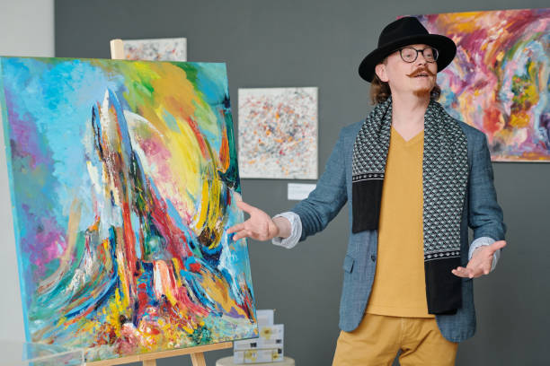 istock Artist presenting his artwork in gallery 1495955823