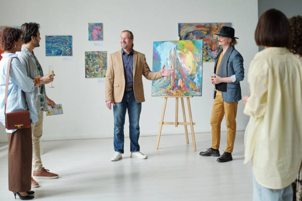 istock Group of people visiting art gallery 1495955907