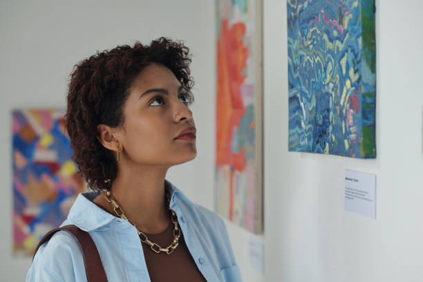 istock Young woman enjoying modern art in gallery 1495956047