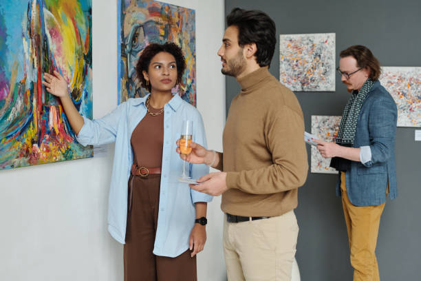 istock People enjoying modern art in gallery 1495956130