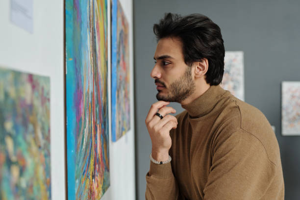 istock Man enjoying modern art in gallery 1495956140