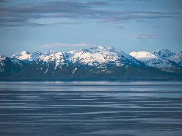 View from a trail overlooking Juneau, Alaska with mountain range in the background