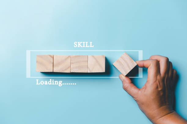 istock Success and necessary skills in graduation or education. Knowledge and teaching. Wooden cubes with graduation and education symbols linked. education concept. Creative idea and innovation. 1495965747