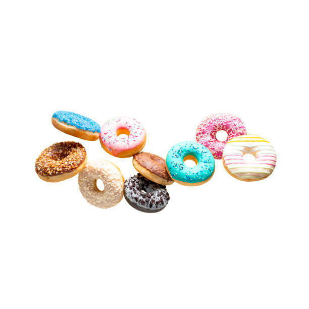 istock Sweet donuts of different colors in flight on a white background 1495966329
