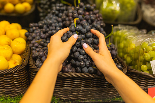 Grape. Vegetarianism. Healthy food. Choice. Shopping