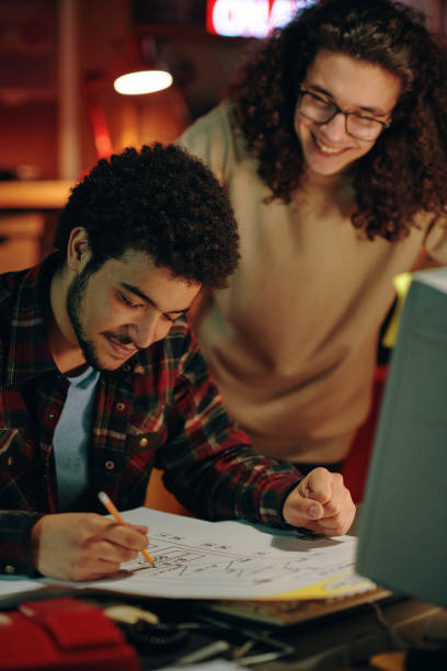 istock Guys drawing business plan on paper 1495967520